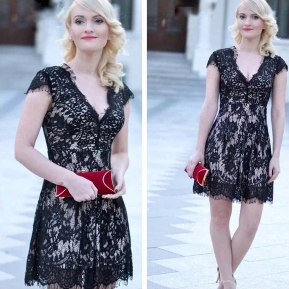 Worn once. Black lace V neck dress.